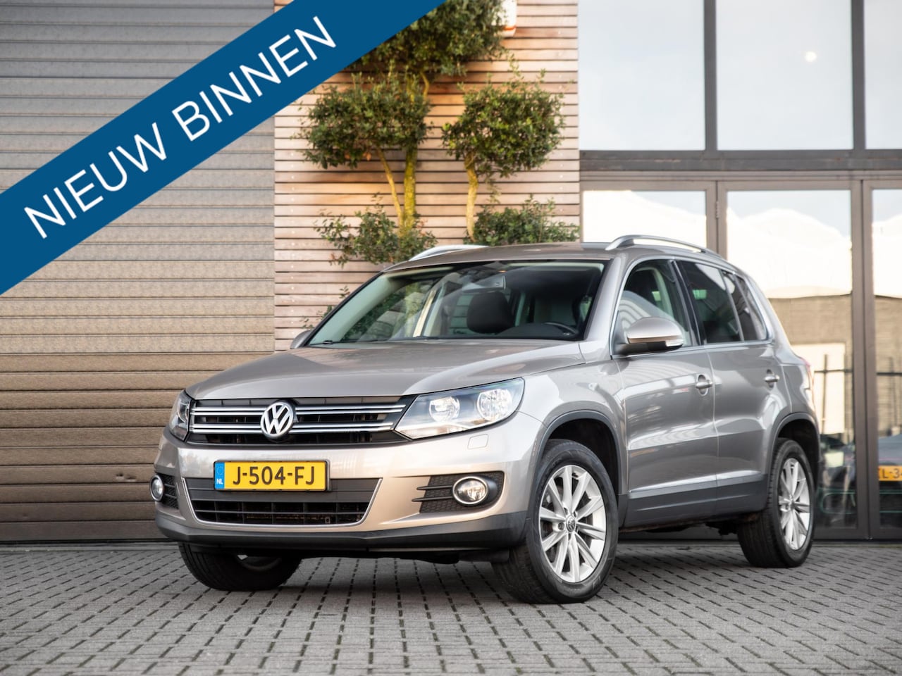 Volkswagen Tiguan - 2.0 TSI Sport&Style 4Motion Cruise Stoelv Carplay - AutoWereld.nl