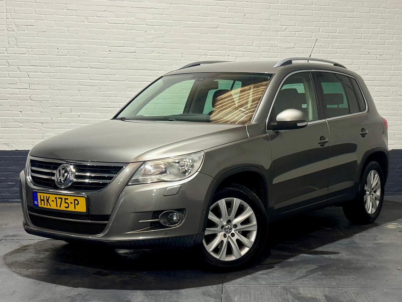 Volkswagen Tiguan - 1.4 TSI Sport&Style 4Motion Stoelverwarming - AutoWereld.nl