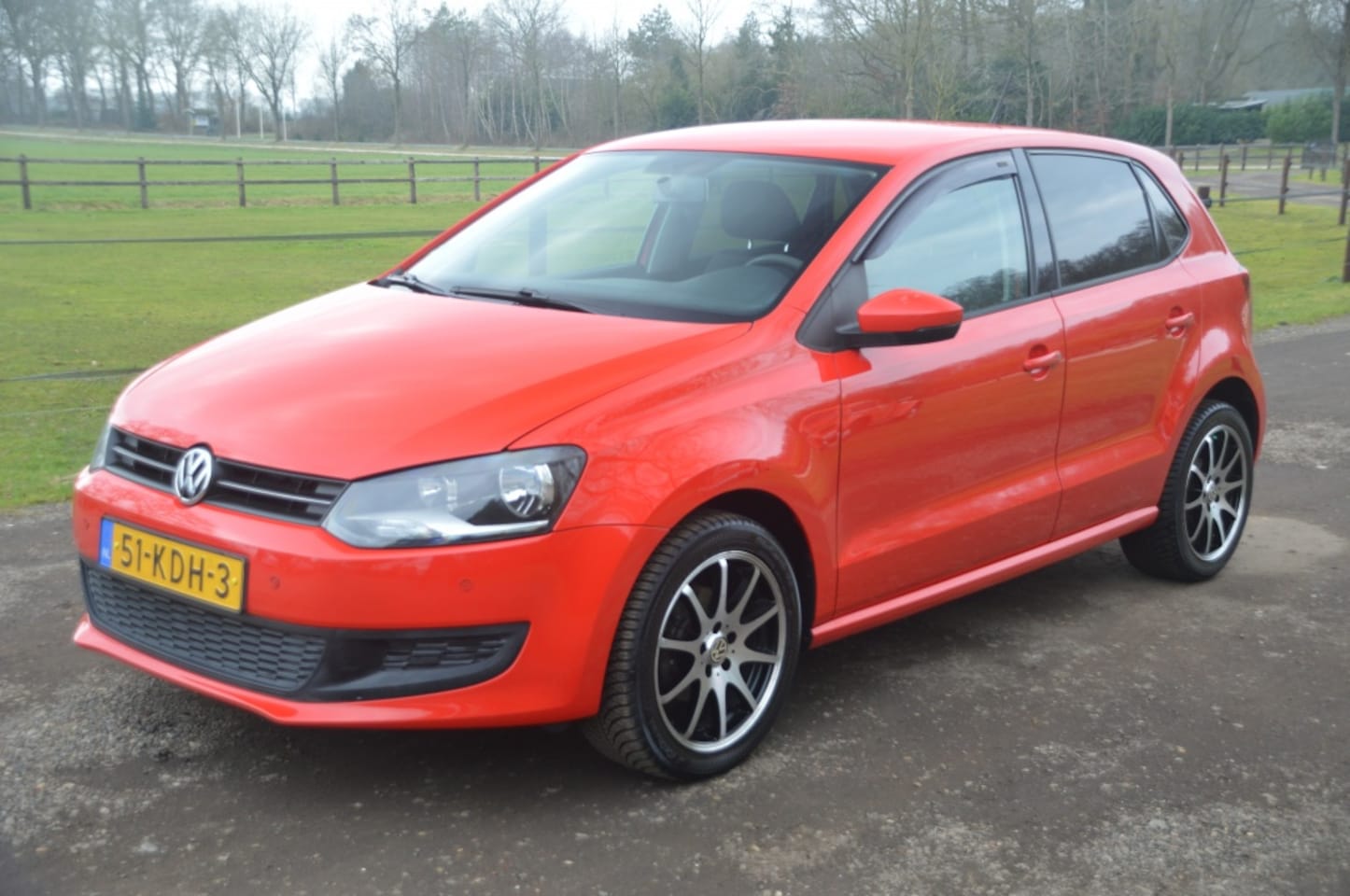 Volkswagen Polo - 1.2-12V Comfortline Airco Cruise Navi PDC - AutoWereld.nl