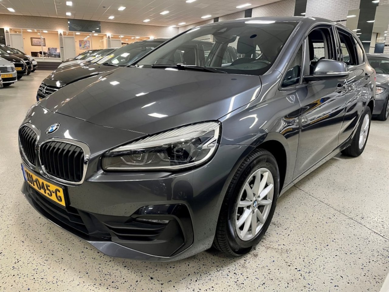 BMW 2-serie Active Tourer - 218I EXE 140pk Automaat Navigatie LED Climat Cruise PDC - AutoWereld.nl