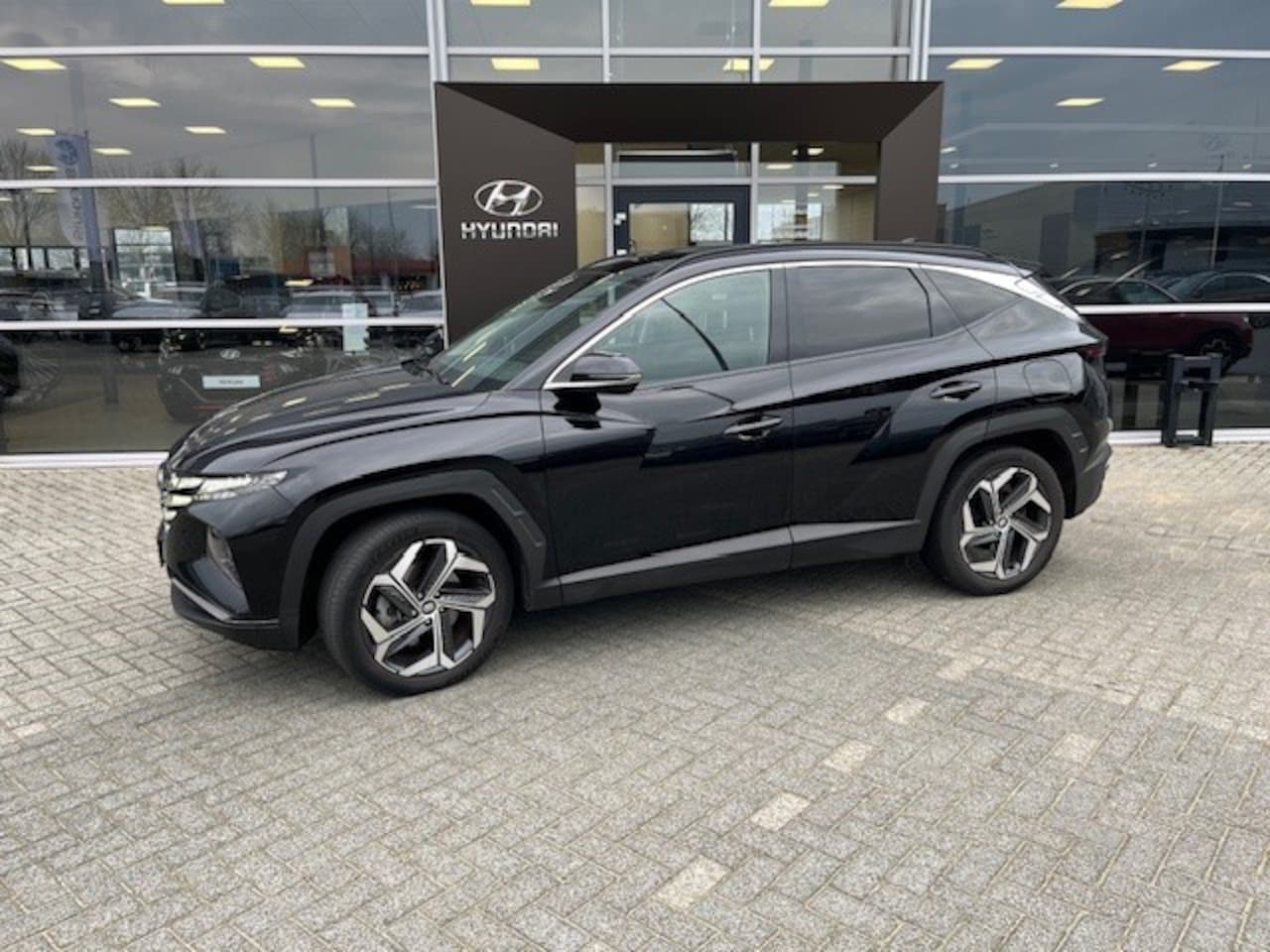 Hyundai Tucson - 1.6 T-GDI PHEV Comfort 4WD | Apple Carplay/Android Auto|telefoonintegratie premium | airco - AutoWereld.nl