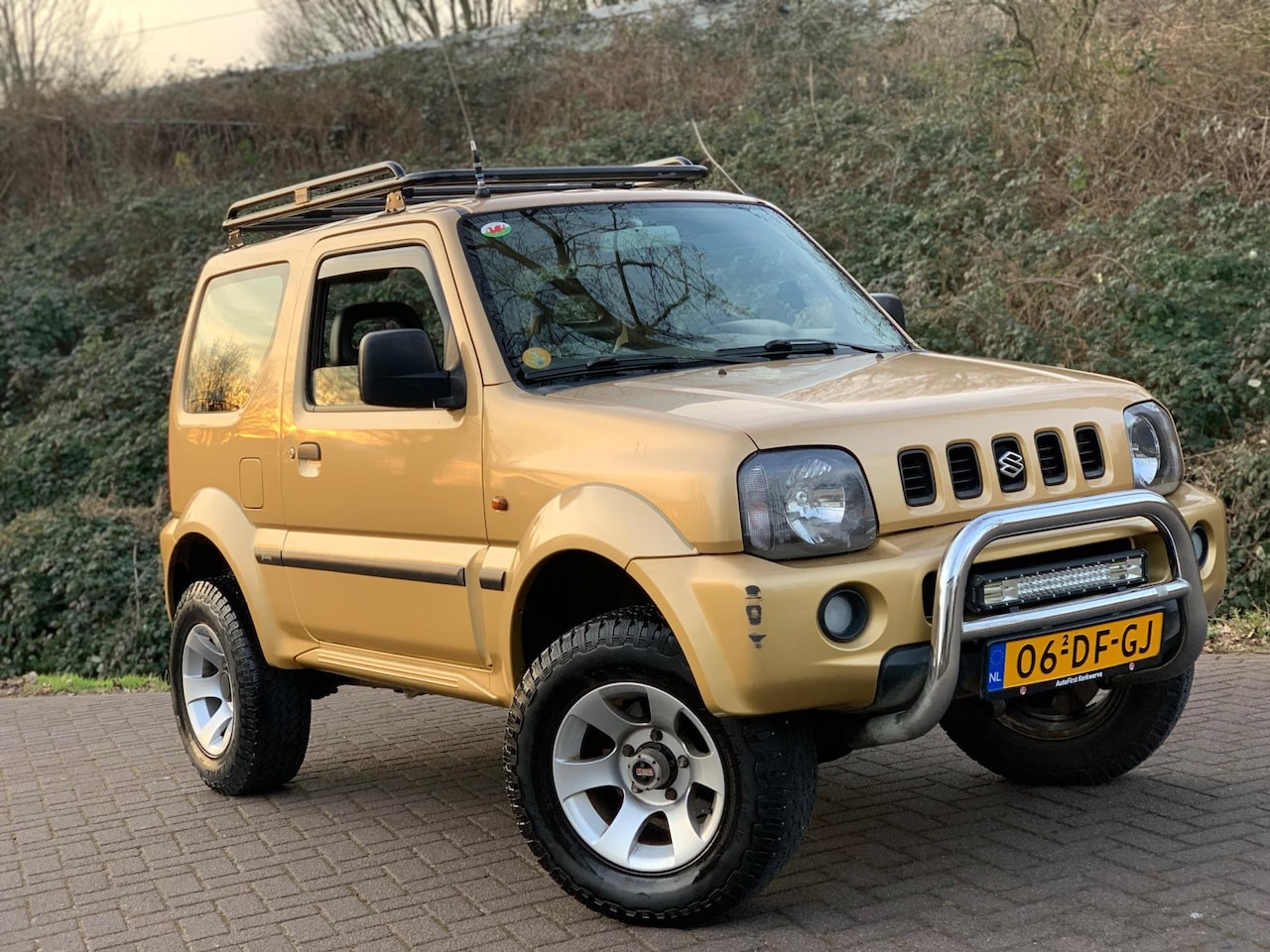 Suzuki Jimny - 1.3 JLX 4X4 AWD AUTOMAAT AIRCO BULLBARS VERHOOGD ! - AutoWereld.nl