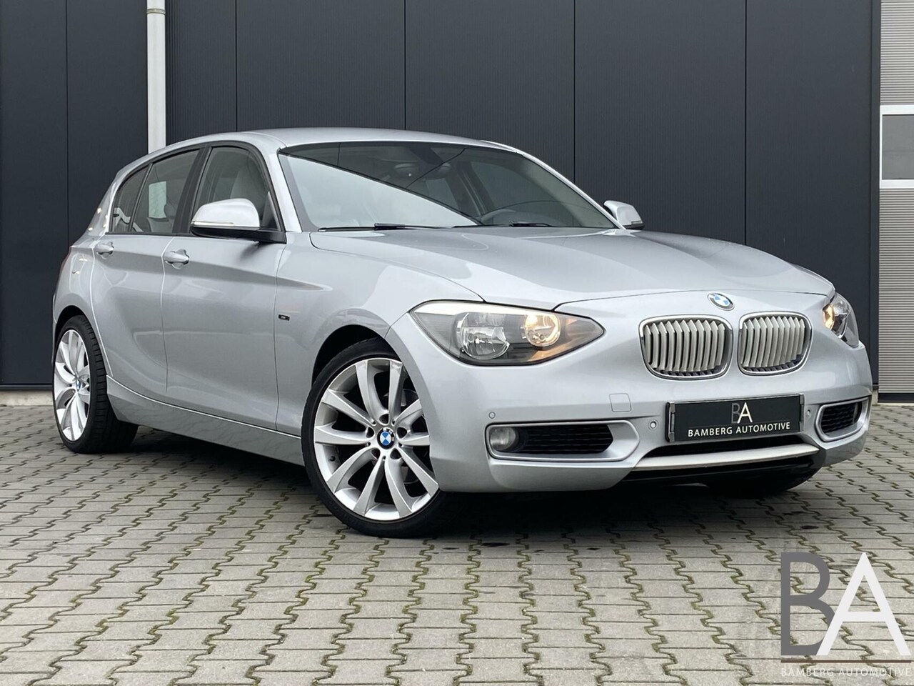 BMW 1-serie - 118i Urban |leder|cruise|stoelverwarming|navi - AutoWereld.nl