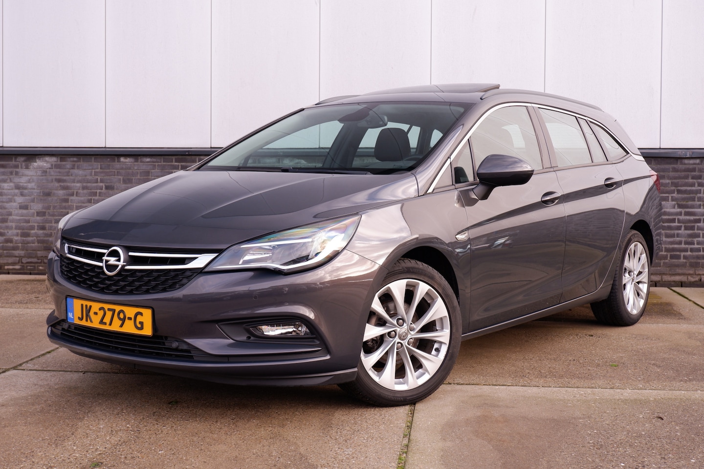 Opel Astra Sports Tourer - 1.0 Edition | Schuifdak | Trekhaak | Navi | Cruise | PDC | Carplay - AutoWereld.nl