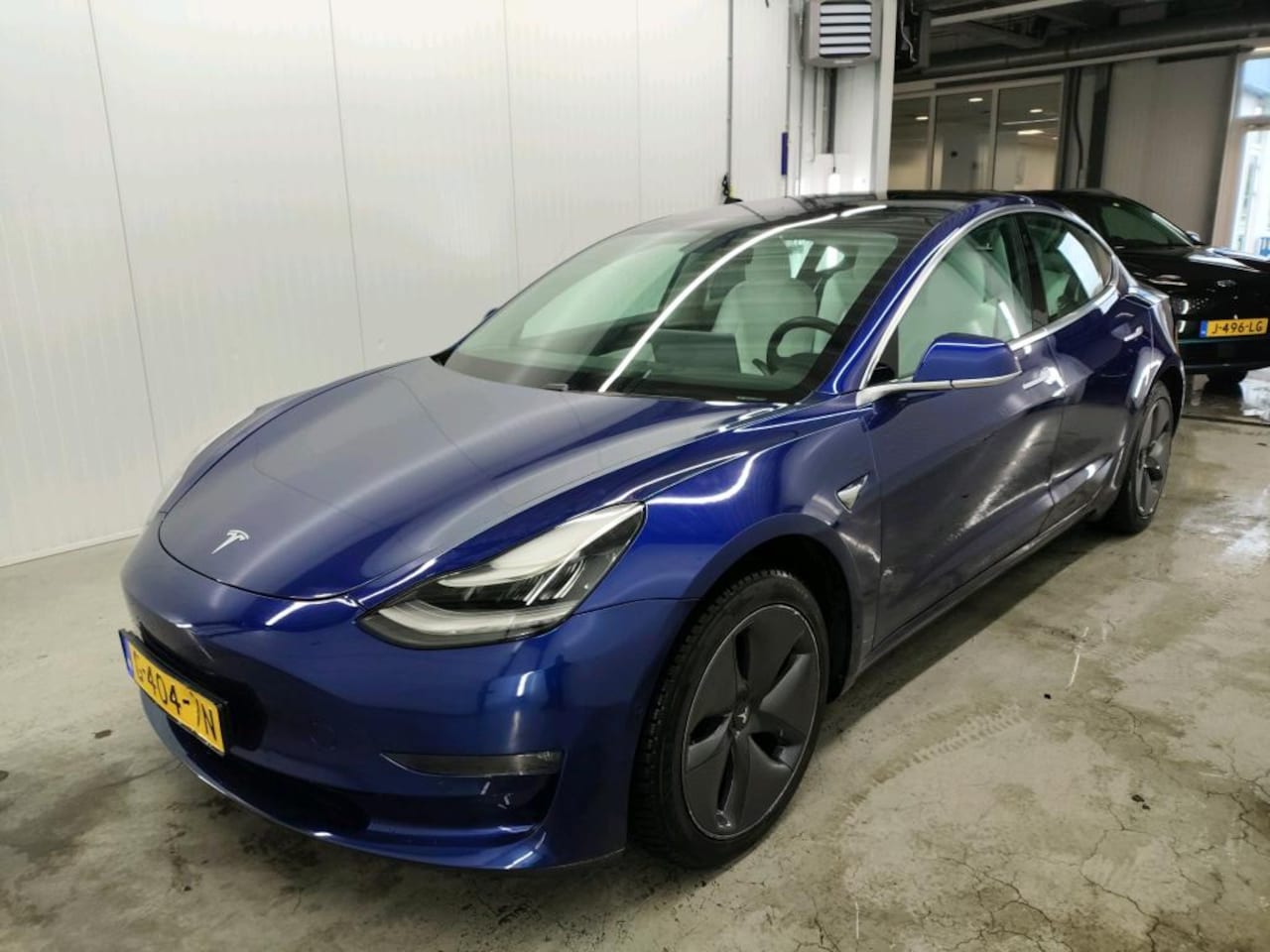 Tesla Model 3 - Long-Range AWD 351pk 75 kWh [ WIT LEDER+TREKHAAK+AUTOPILOT+620KM WLTP+PREMIUM AUDIO ] - AutoWereld.nl