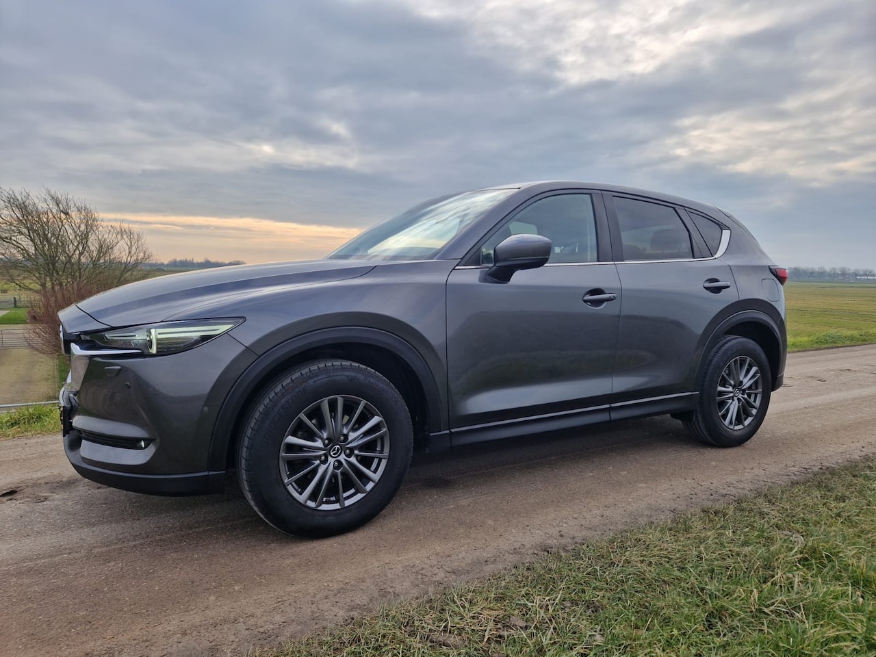 Mazda CX-5 - 2.0 SkyActiv-G 165 TS+ Grijs metallic Automaat - 6 versnellingen 165 PK Leeggewicht: 1365 - AutoWereld.nl