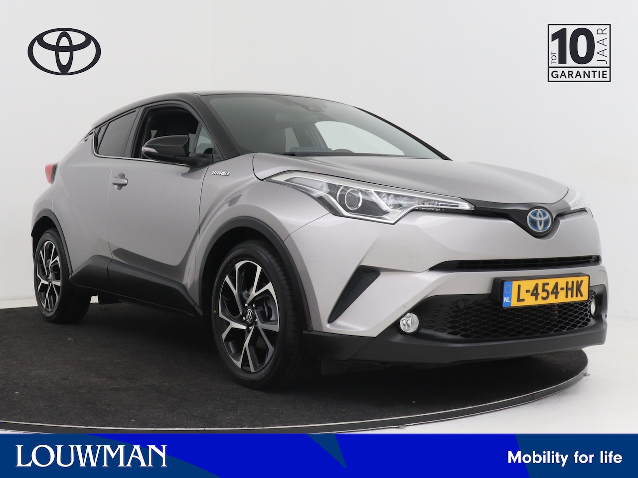 Toyota C-HR - 1.8 Hybrid Bi-Tone Limited | Leder | Navigatie | Camera | LM velgen | Stoelverwarming | Cr - AutoWereld.nl