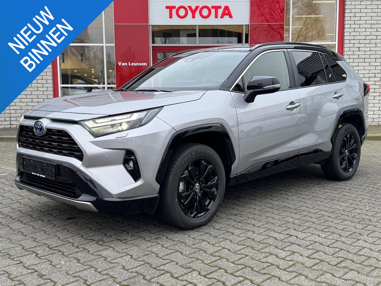 Toyota RAV4 - 2.5 HYBRID ADW BI-TONE STOEL/STUURVERW. EL-VERSTELBARE STOEL EL-ACHTERKLEP NAVI PARKSENSOR - AutoWereld.nl