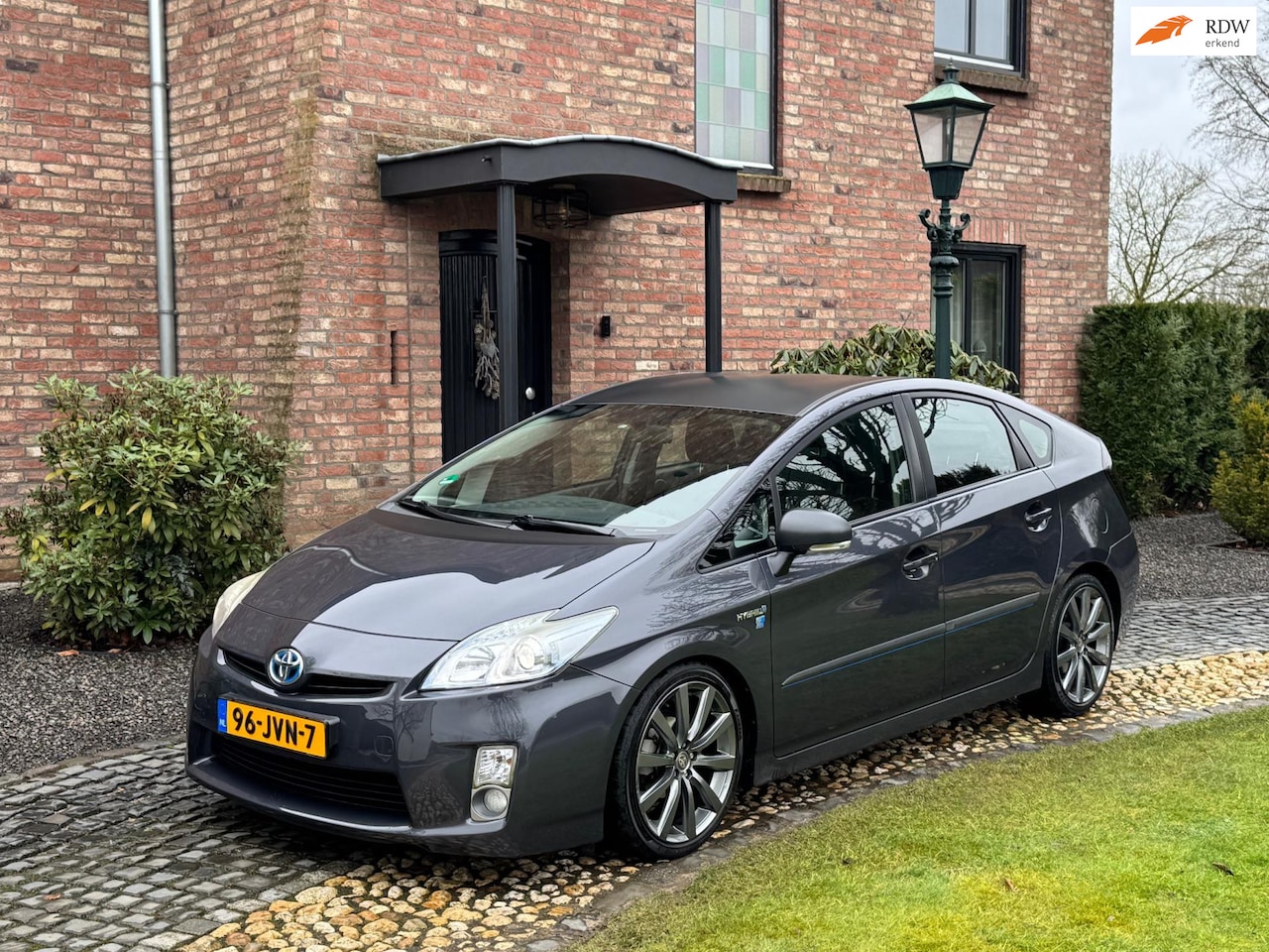 Toyota Prius - 1.8 Hybrid Leer Navi Camera HUD 18inch! - AutoWereld.nl