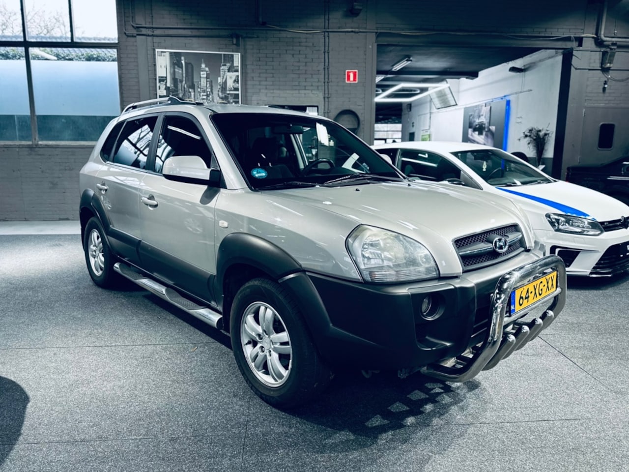 Hyundai Tucson - 2.0i Dynamic Sense - Airco - Trekhaak - APK - AutoWereld.nl