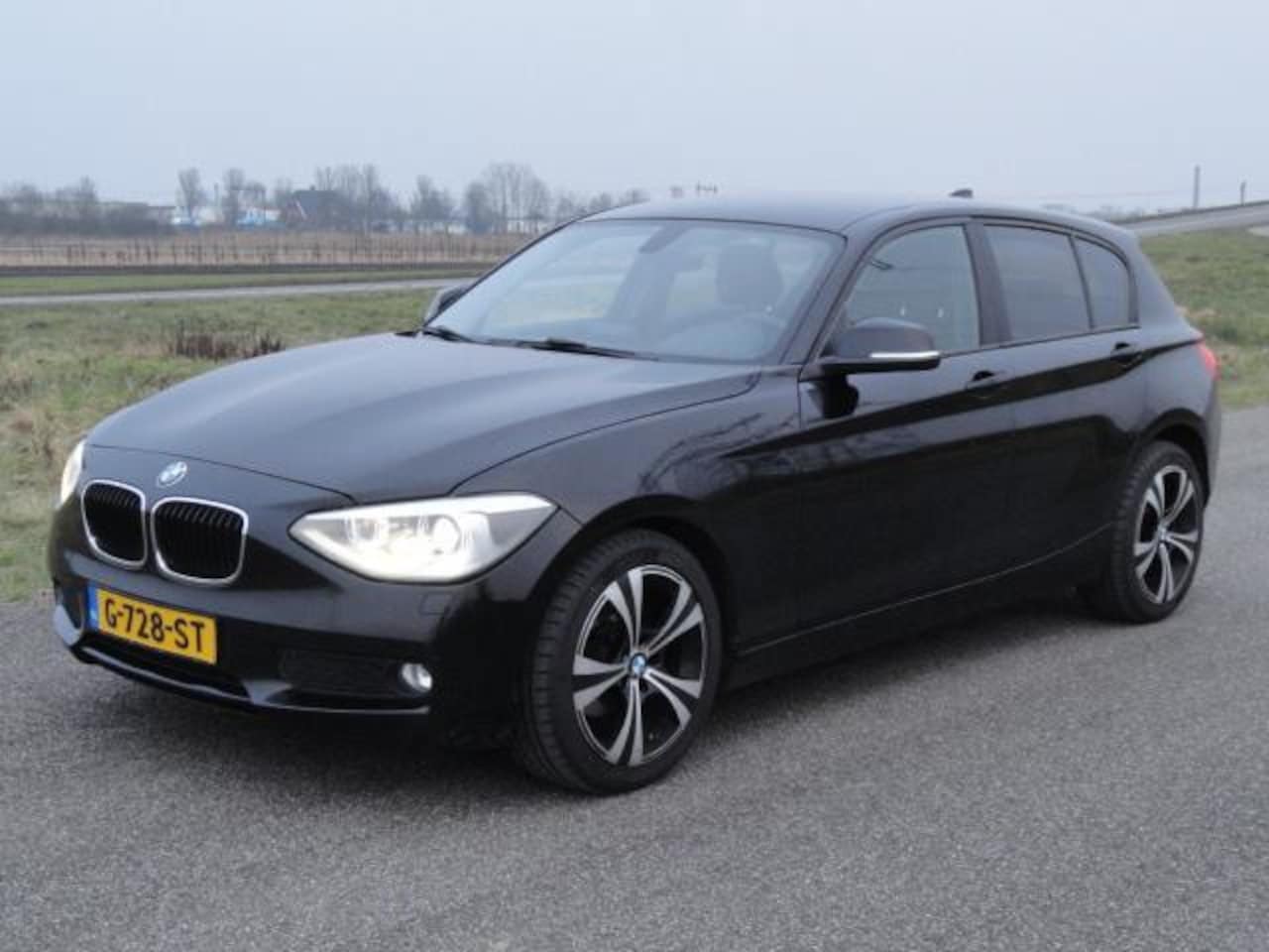 BMW 1-serie - 116d High Executive Met NAVIG I ECC I STOEL VERW - AutoWereld.nl