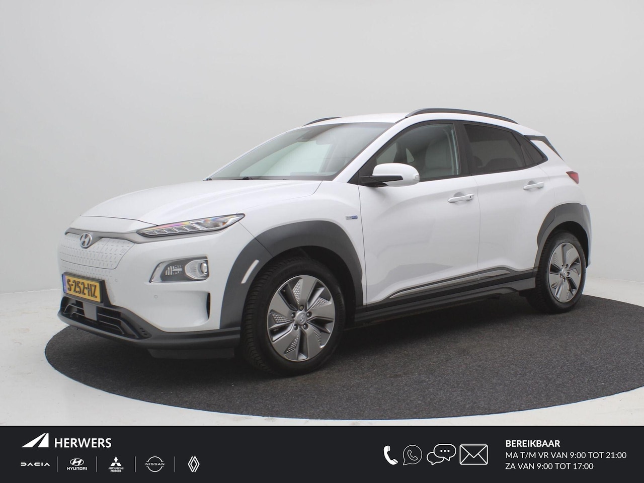 Hyundai Kona Electric - EV Premium 64 kWh / Warmtepomp / 3-Fase laden / Bluelink / SoH 100% / Navigatie / All seas - AutoWereld.nl