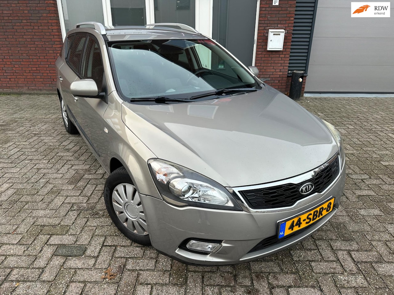 Kia Cee'd Sporty Wagon - 1.4 CVVT Seven / Navi / Cruise / Airco / NAP - AutoWereld.nl