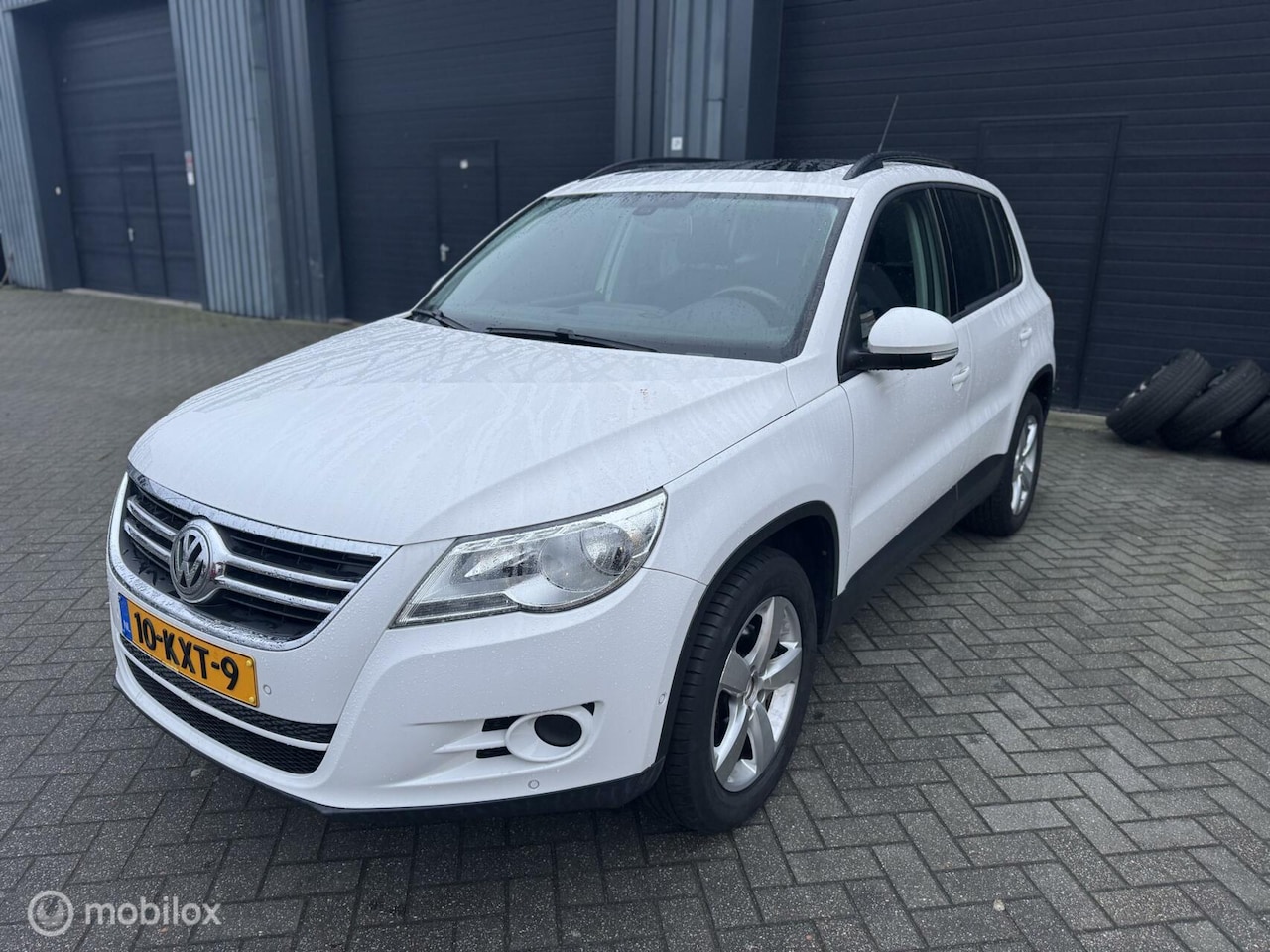 Volkswagen Tiguan - 1.4 TSI Sport&Style|Pano|PDC|Trekhaak - AutoWereld.nl