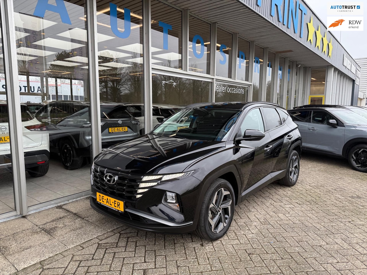 Hyundai Tucson - 1.6 T-GDI PHEV Premium 4WD 265PK / NAVIGATIE / ACHTERUITRIJCAMERA - AutoWereld.nl