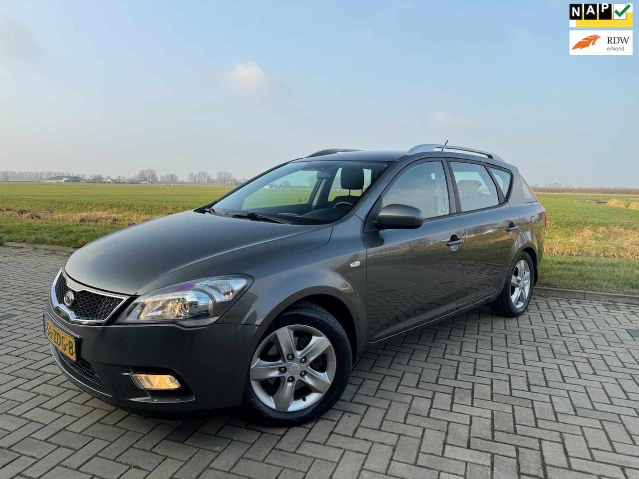 Kia Cee'd Sporty Wagon - Ceed 1.4 CVVT Comfort Pack 2012 Airco Clima Trekhaak Cruise control Parrot telefoon - AutoWereld.nl