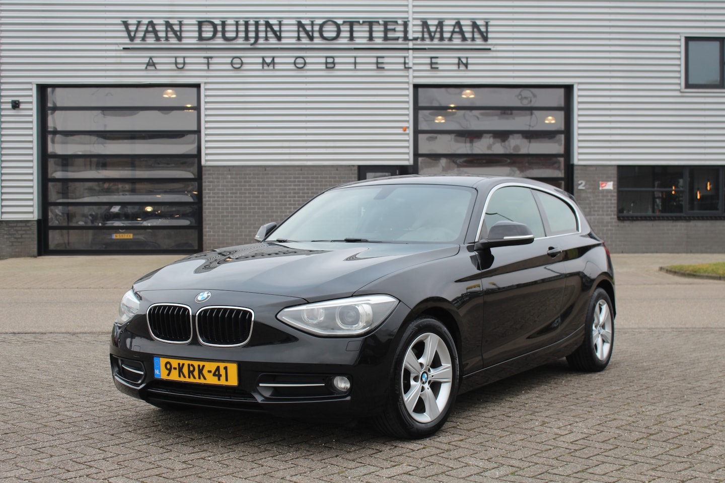 BMW 1-serie - 114i EDE Executive / Xenon / Navigatie / N.A.P. - AutoWereld.nl