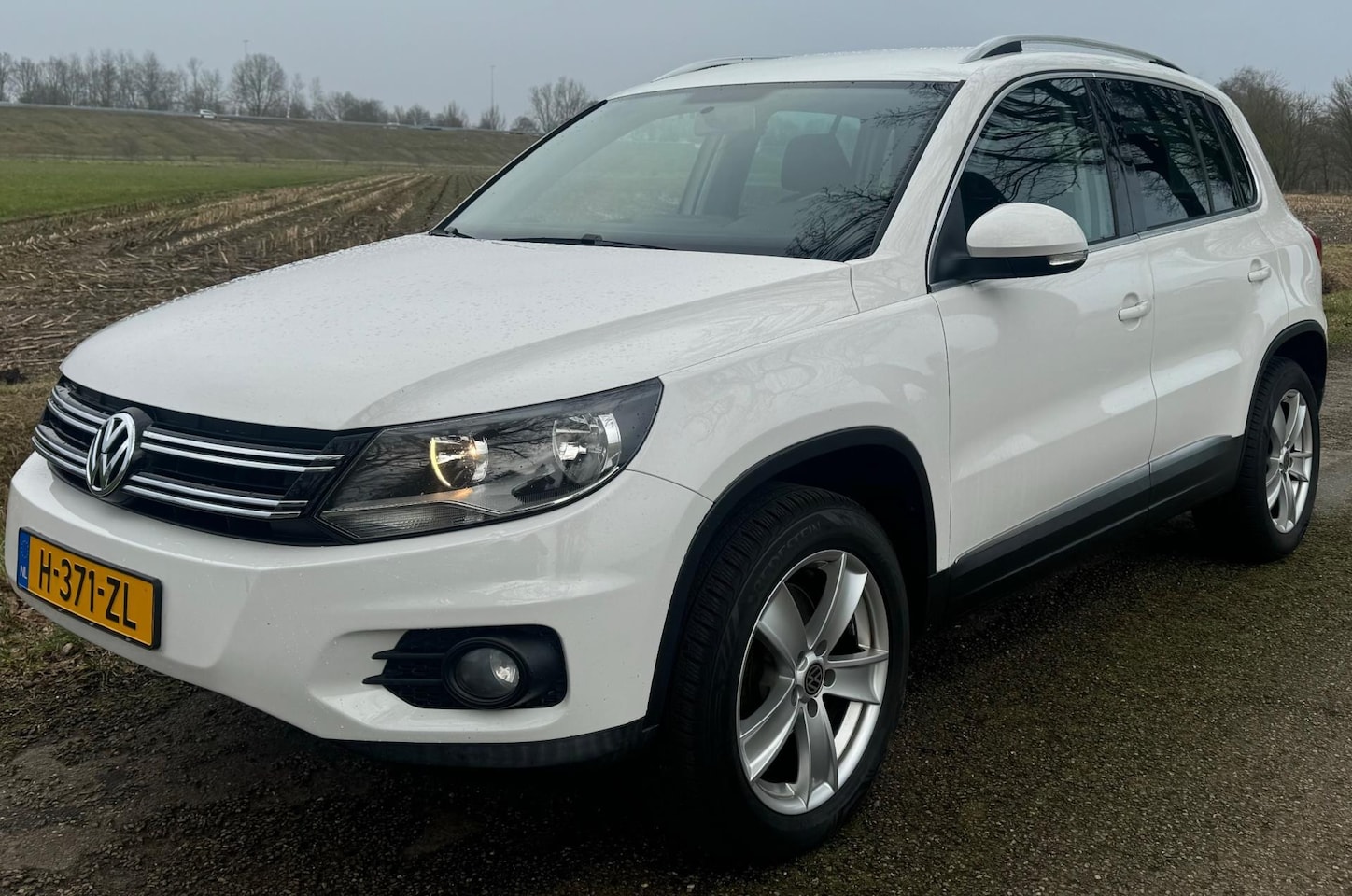 Volkswagen Tiguan - 2.0 TSI 2013 Sport&Style AUTOMAAT CLIMA CRUISE - AutoWereld.nl