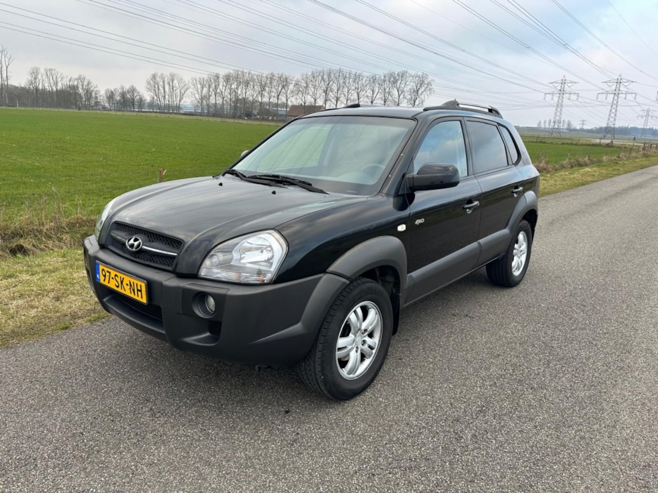 Hyundai Tucson - 2.7i V6 4WD Style DEALER ONDERHOUDEN ! - AutoWereld.nl