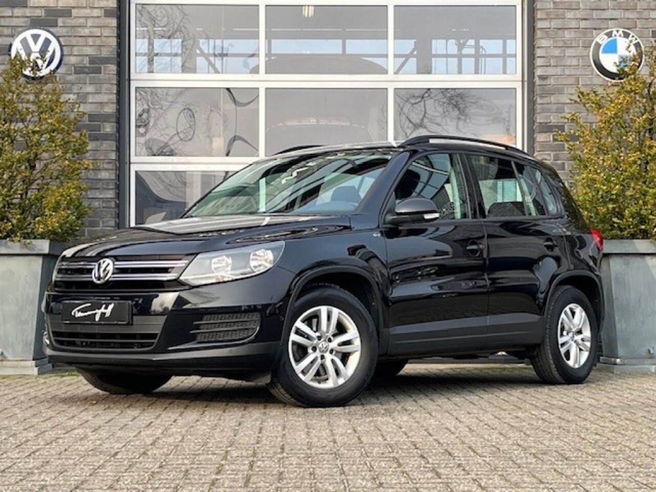 Volkswagen Tiguan - 1.4 TSI 123PK CLIMA - NAVI - STOELVERW. - PDC - TREKH. - AutoWereld.nl