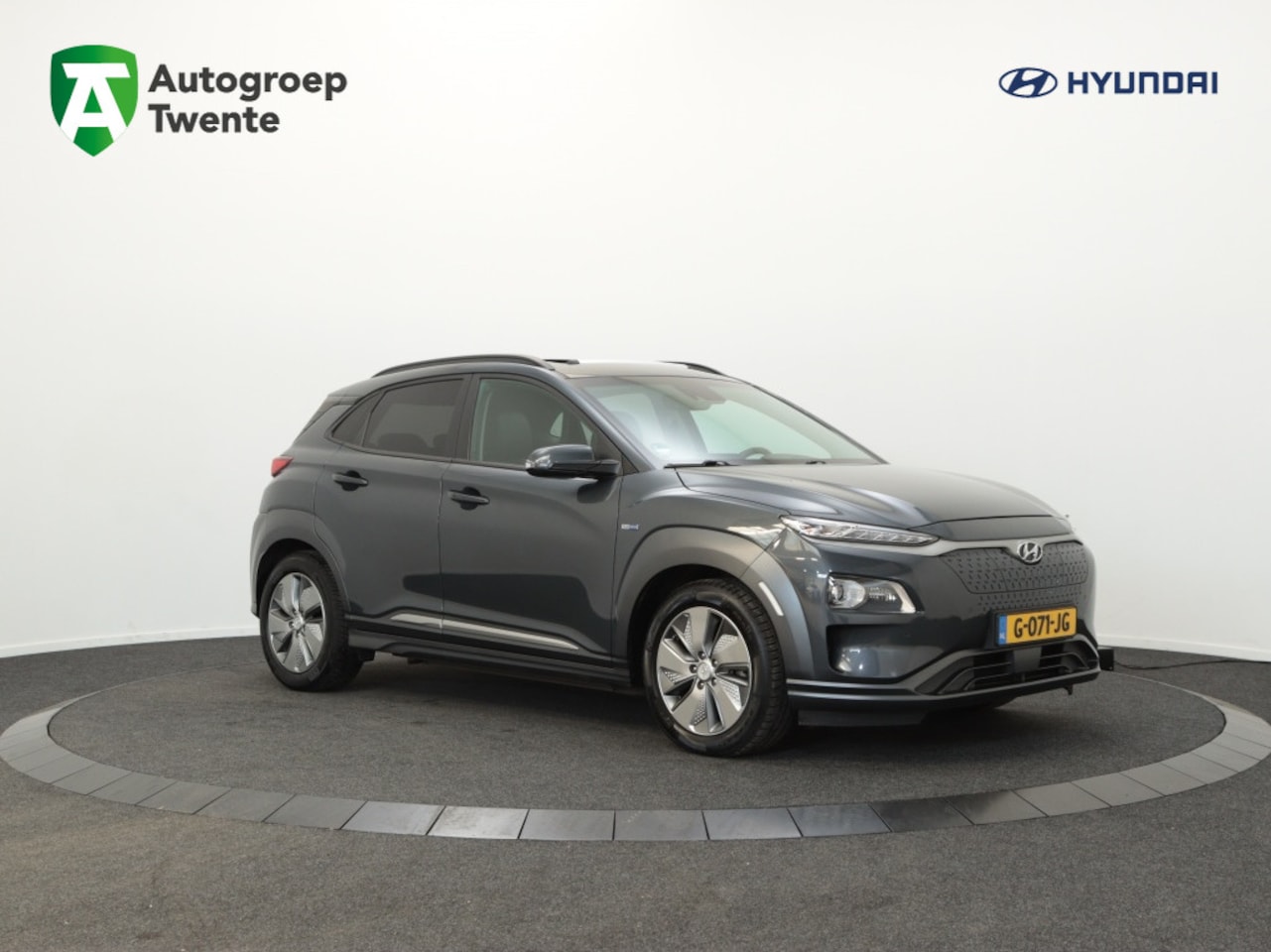 Hyundai Kona Electric - EV Premium 64 kWh | Panoramadak | Leer | Navigatie | Camera | Ca - AutoWereld.nl