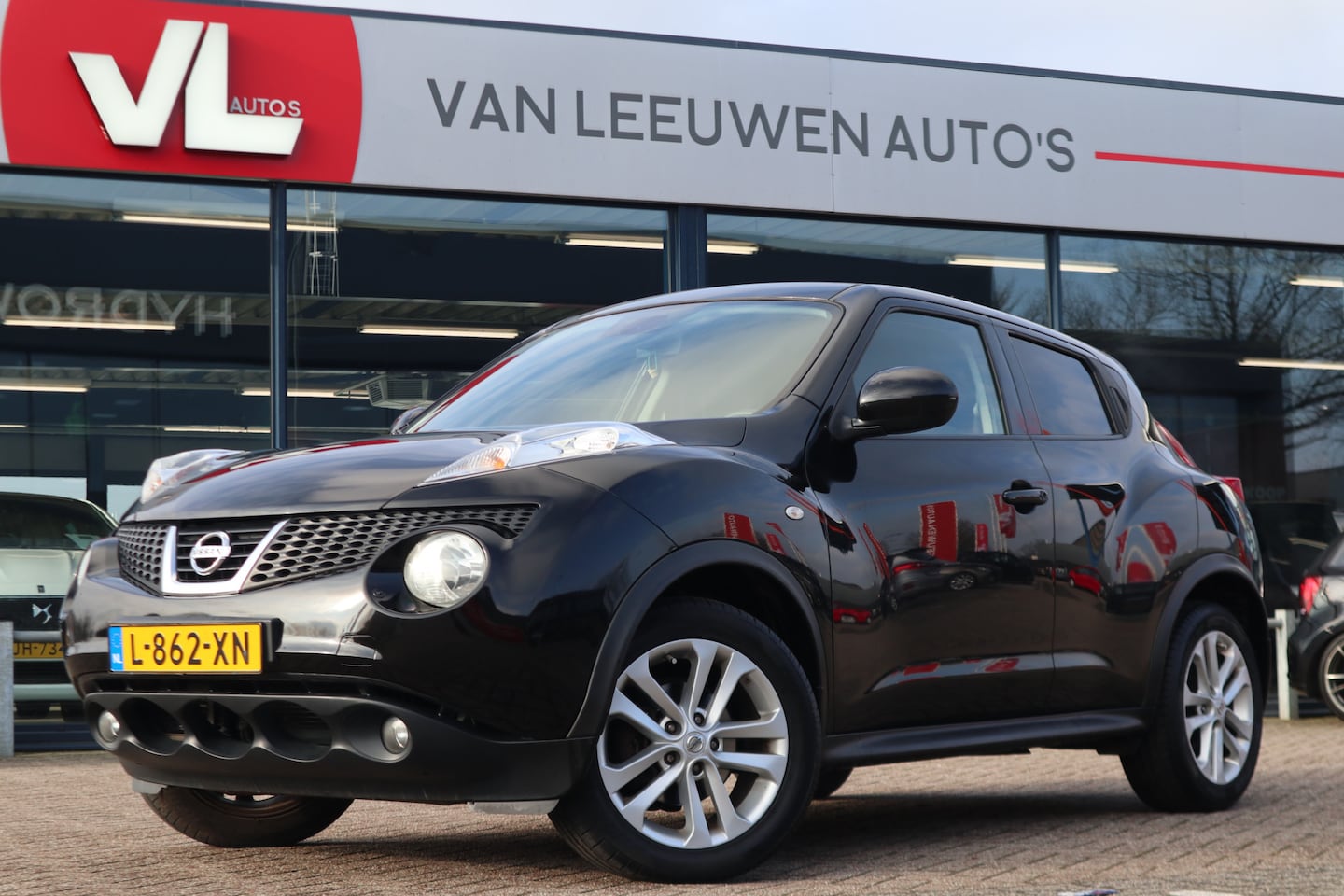 Nissan Juke - 1.6 Tekna | Cruise | Navi | Trekhaak - AutoWereld.nl