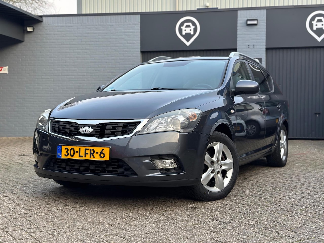 Kia Cee'd Sporty Wagon - 1.4 | Cruise | Navi | Trekhaak - AutoWereld.nl