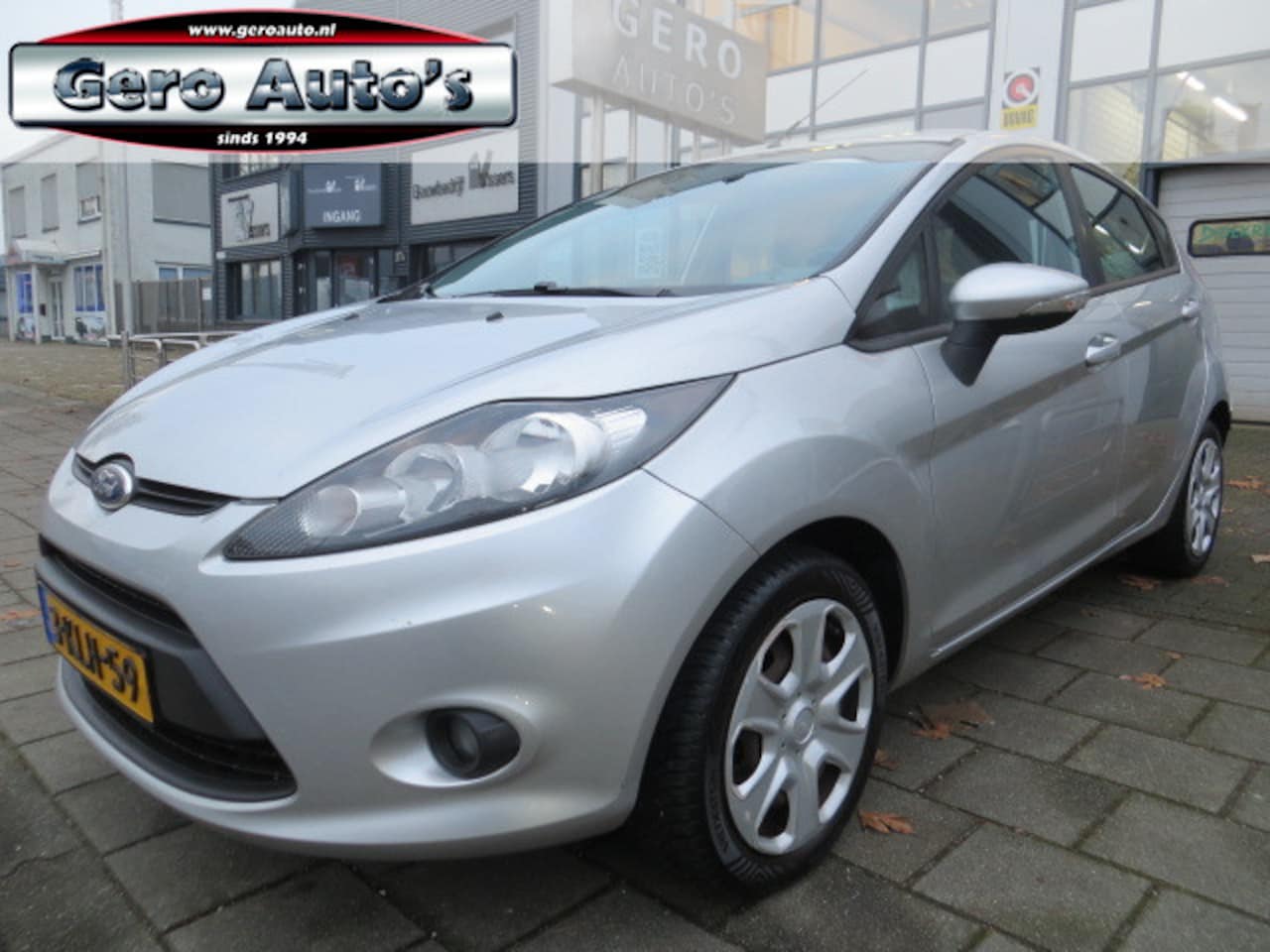 Ford Fiesta - 1.25 ghia 5 deurs airco ecc ,elek pakket - AutoWereld.nl