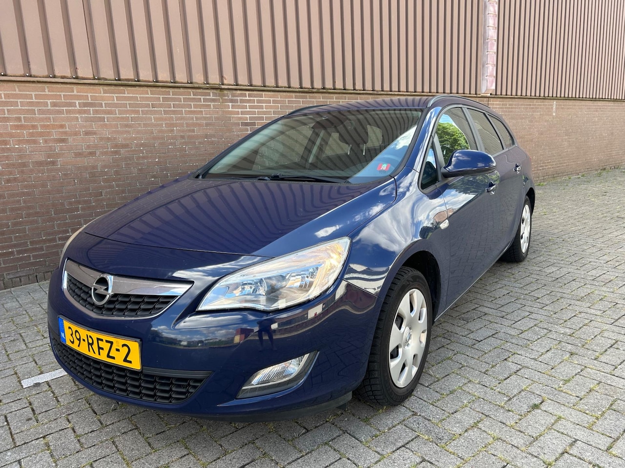 Opel Astra Sports Tourer - 1.4 Edition Navi Airco Trekhaak Cruise - AutoWereld.nl