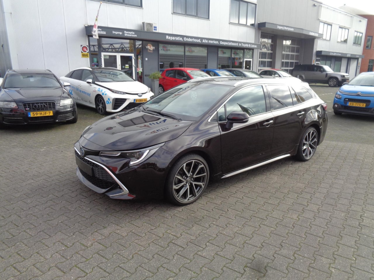 Toyota Corolla Touring Sports - 2.0 Hybrid Executive 184 PK Phantom Brown - AutoWereld.nl