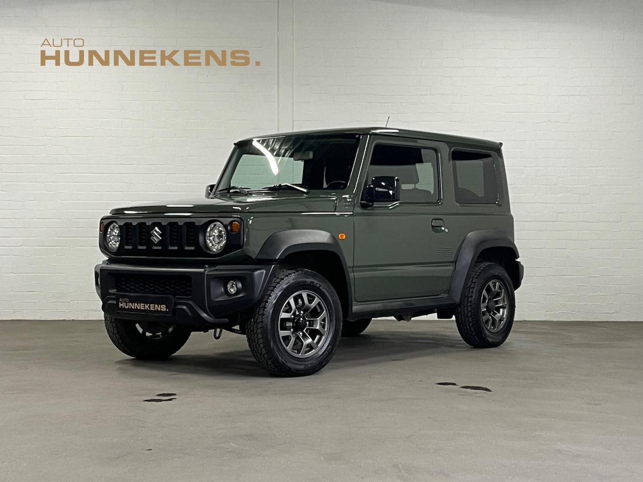 Suzuki Jimny - 1.5 Allgrip Comfort+ | Stoel verwarming | Navigatie | Trekhaak | Cruise & Climate c. - AutoWereld.nl