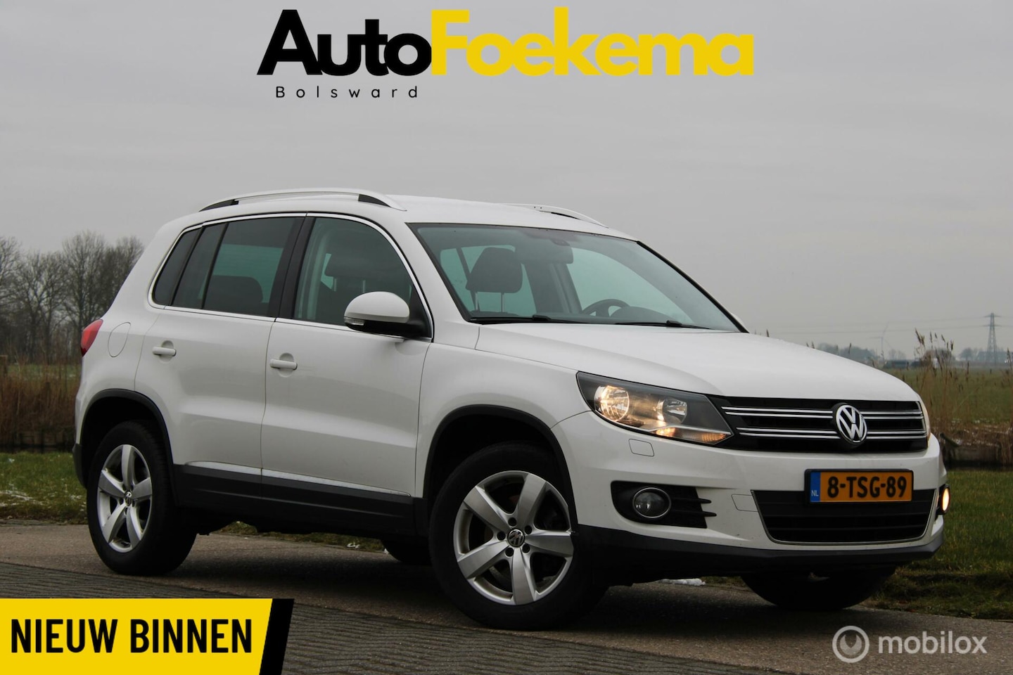 Volkswagen Tiguan - 1.4 TSI Sport&Style UITKLAPBARE TREKHAAK NAVI AIRCO - AutoWereld.nl