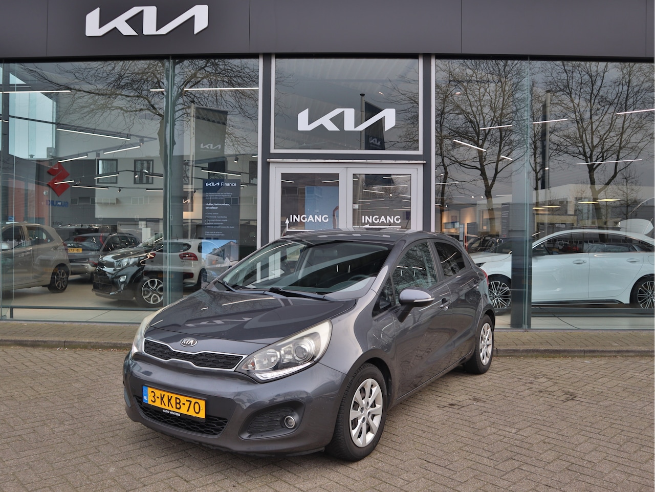 Kia Rio - 1.2 CVVT Plus Pack Airco LED 15"LMV ESP Privacy Glass USB/AUX elec.ramen+Spiegels - AutoWereld.nl