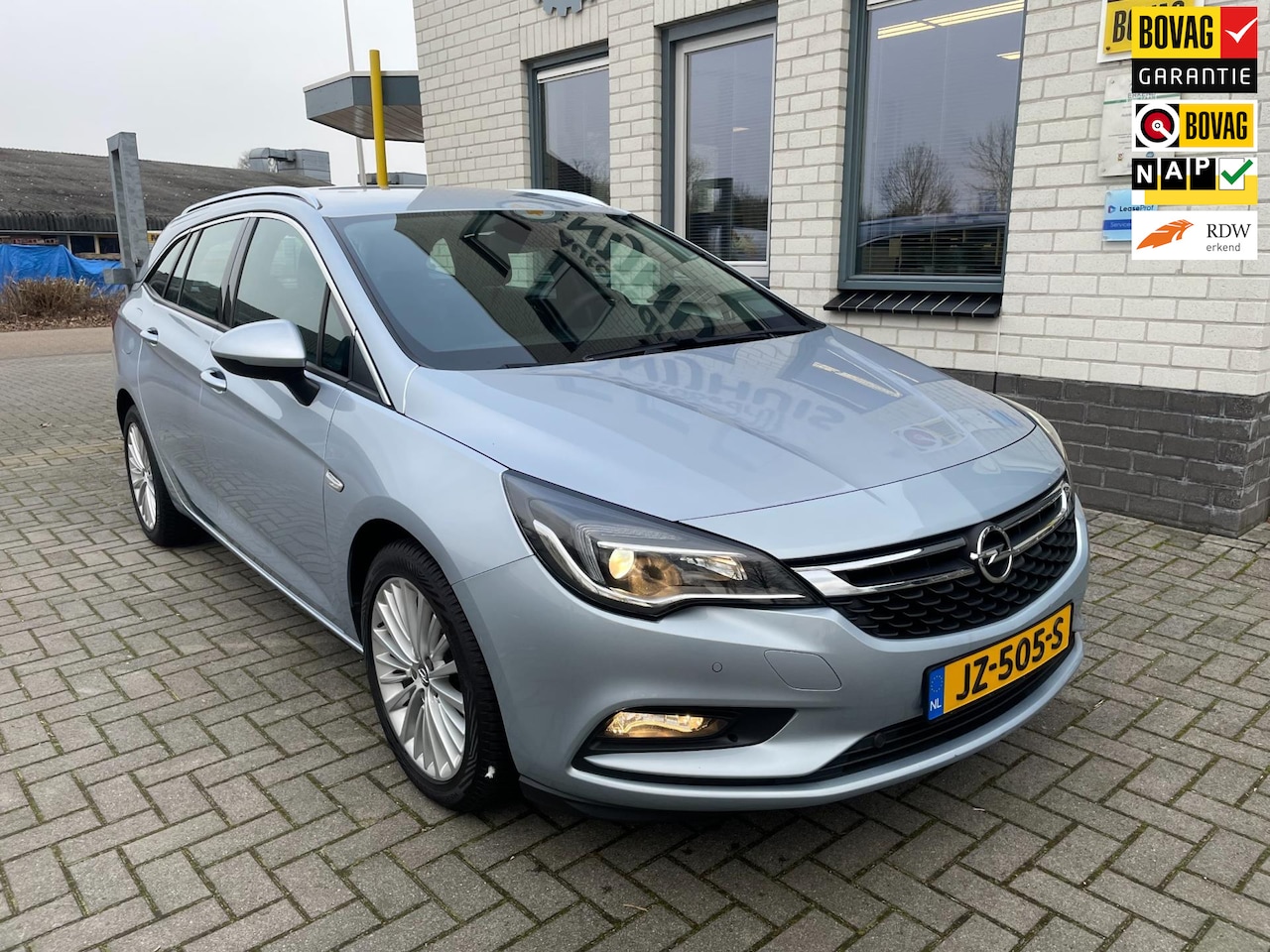 Opel Astra Sports Tourer - 1.0 Innovation / Climate Controle / Add. Cruise / Autom. achterklep / Trekhaak / PDC V+A - AutoWereld.nl