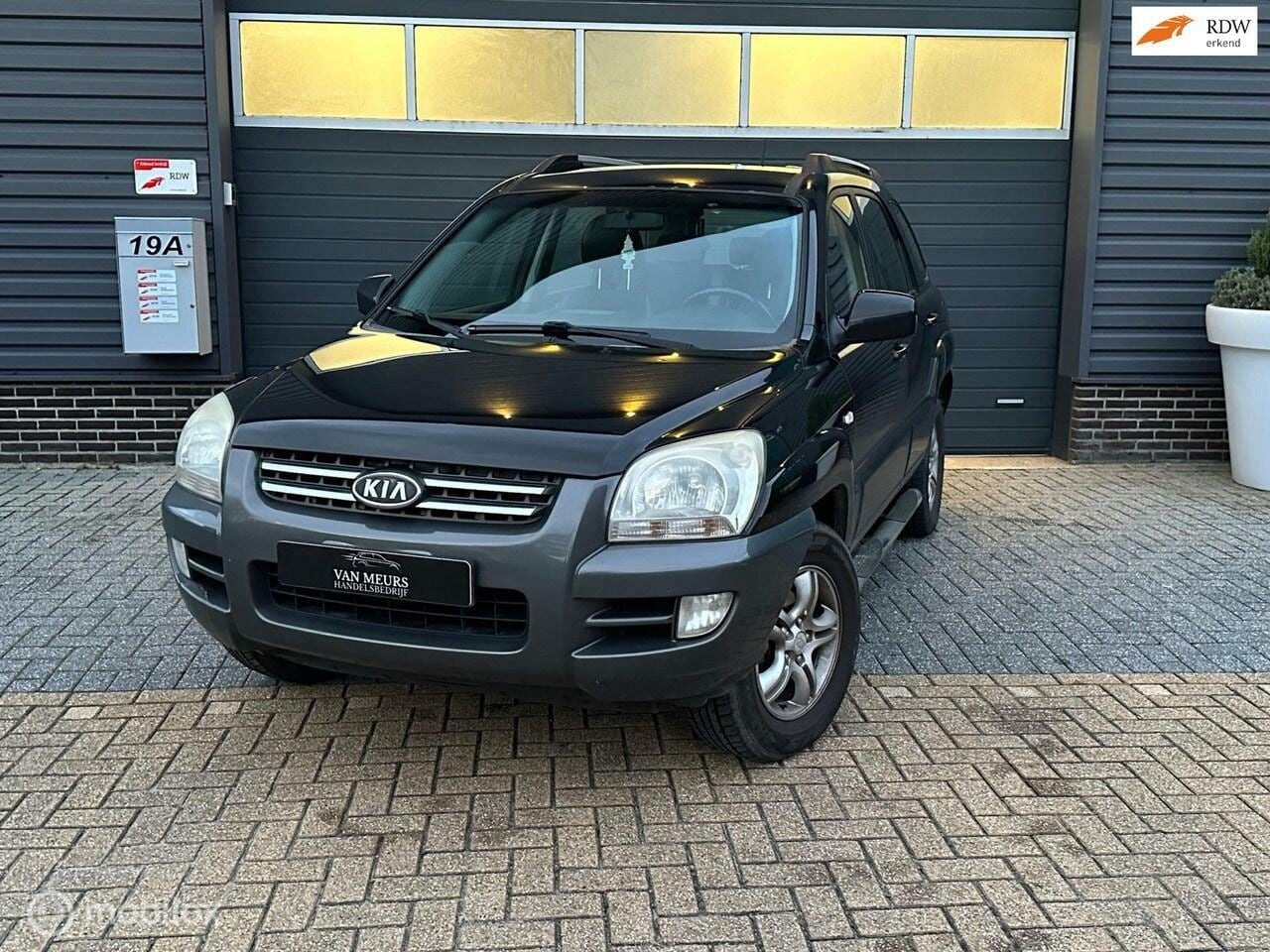 Kia Sportage - 2.0 CVVT X-ecutive 2.0 CVVT X-ecutive, airco, trekhaak, half leder, apk 05-2025 - AutoWereld.nl