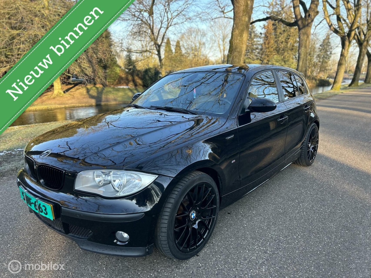 BMW 1-serie - 120i High Executive /AUTOMAAT/NAP/LEER/AIRCO/ - AutoWereld.nl