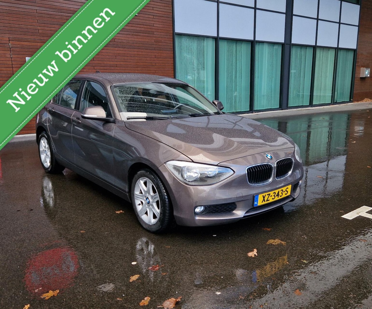 BMW 1-serie - 116i 5Drs 2013 Bruin Airco/Navi/PDC/LM/APK2025 - AutoWereld.nl