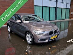 BMW 1-serie - 116i 5Drs 2013 Bruin Airco/Navi/PDC/LM/APK2025