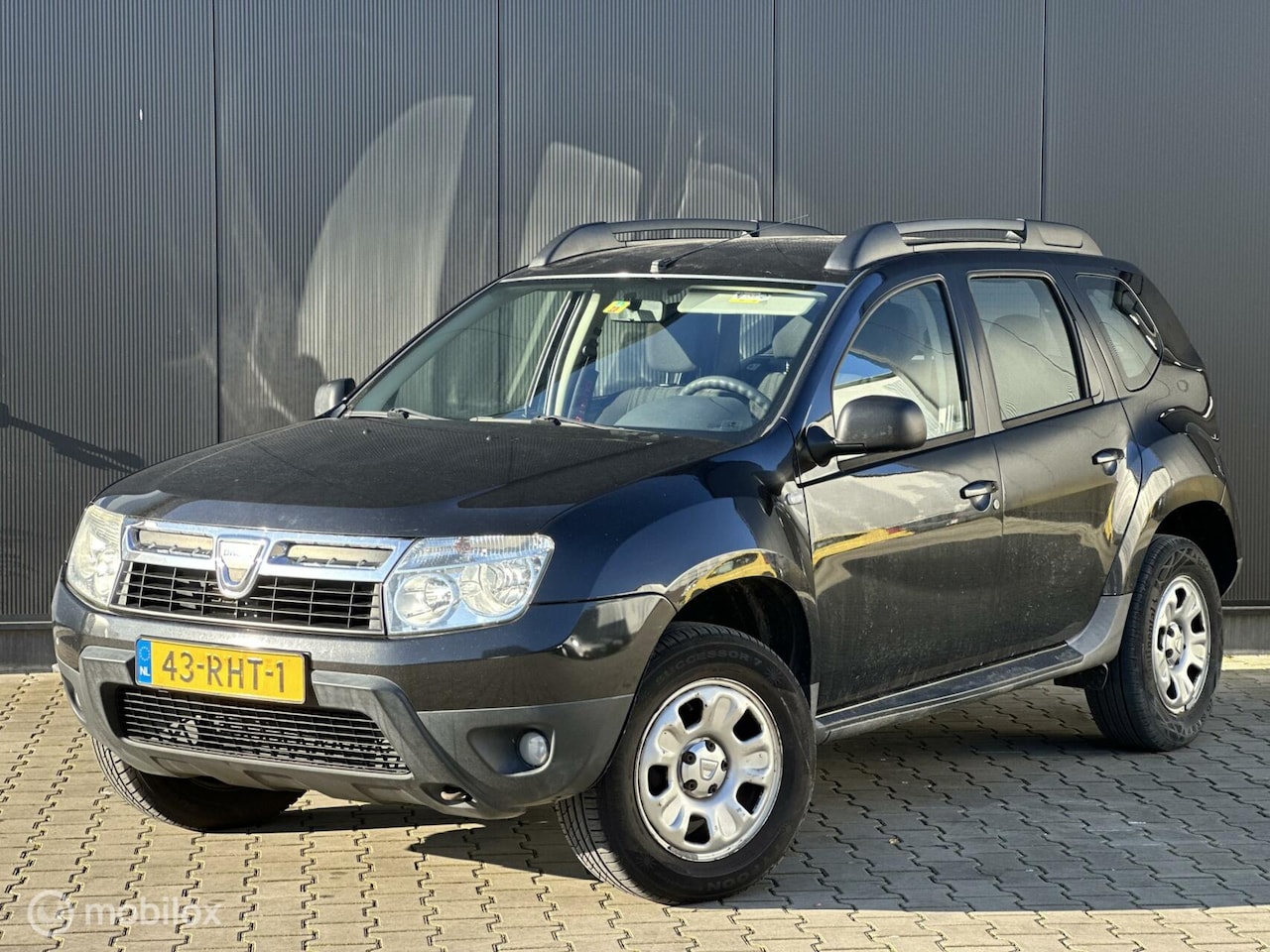 Dacia Duster - 1.6 Lauréate 2wd | CRUISE | AIRCO | TREKHAAK | - AutoWereld.nl