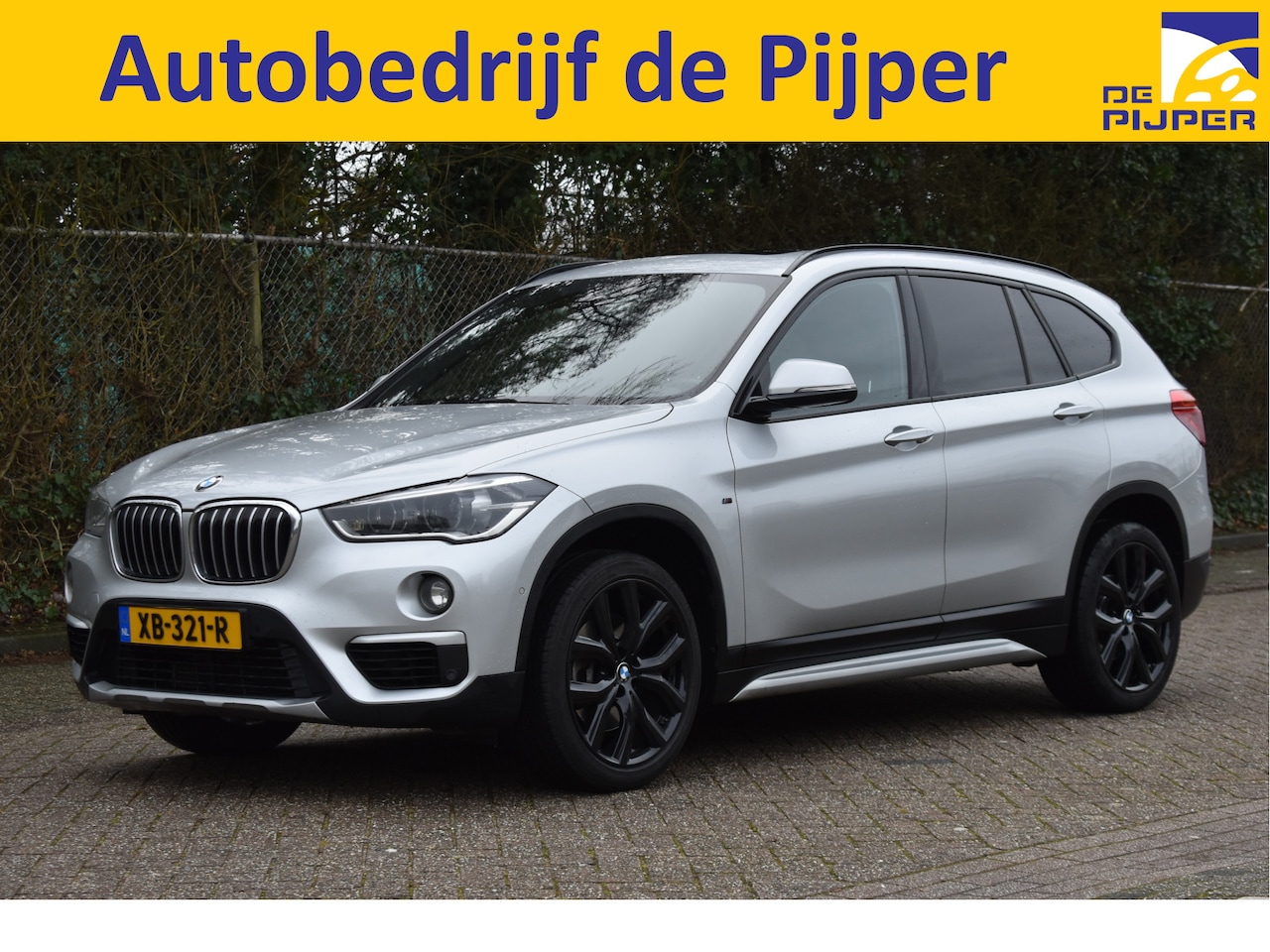 BMW X1 - sDrive20i Orange Edition II Open dak |  Cruise control | Navi |  Trekhaak | - AutoWereld.nl