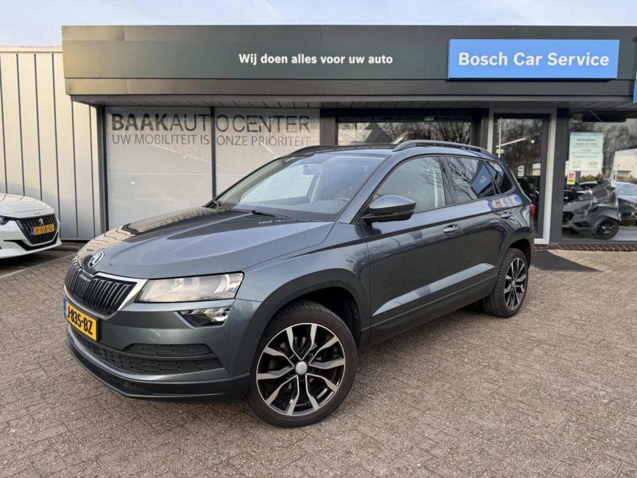 Skoda Karoq - 1.0 TSI Ambition | PDC | Cruise | Trekhaak - AutoWereld.nl