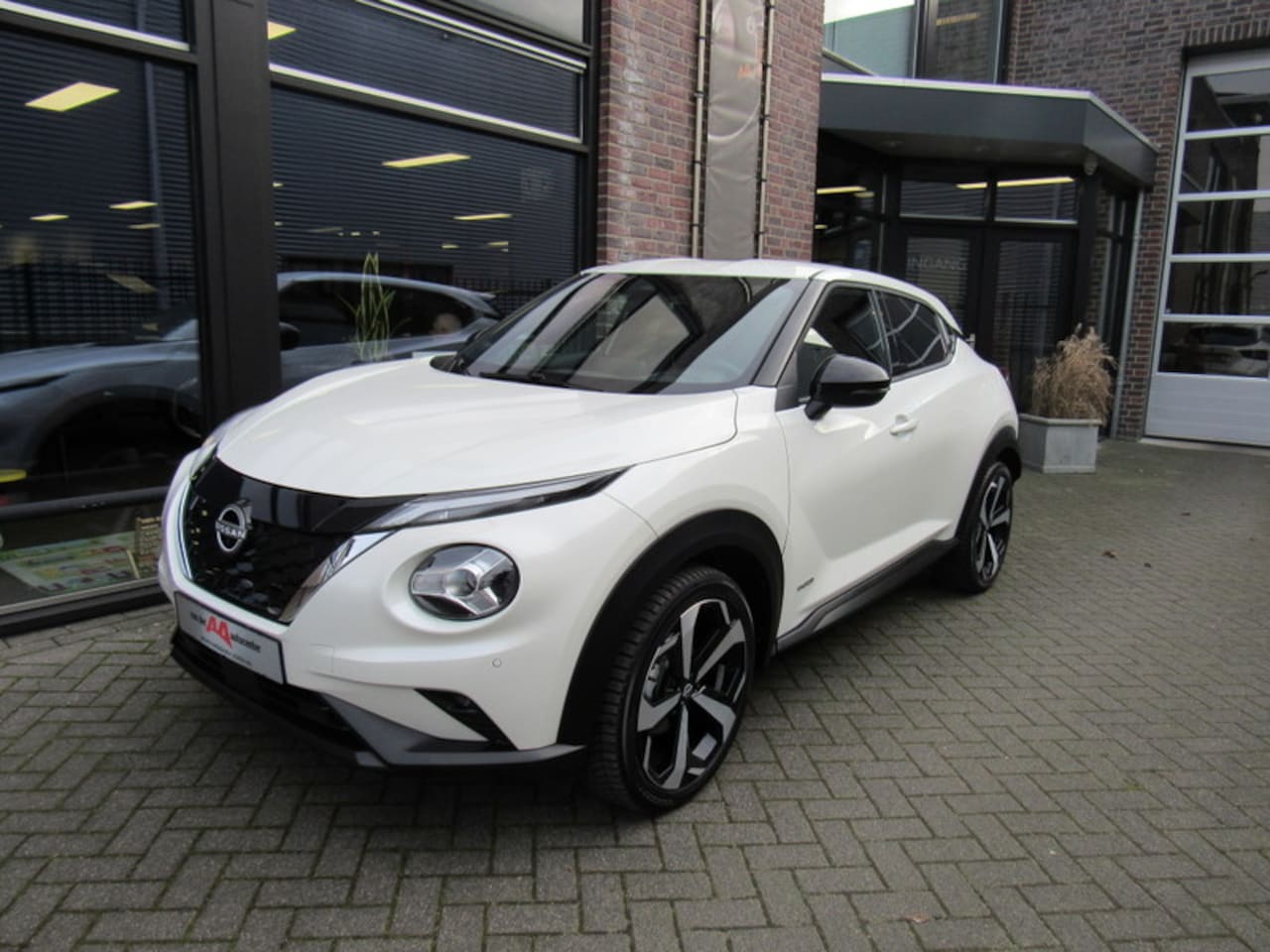 Nissan Juke - Hybrid 143pk Tekna - AutoWereld.nl