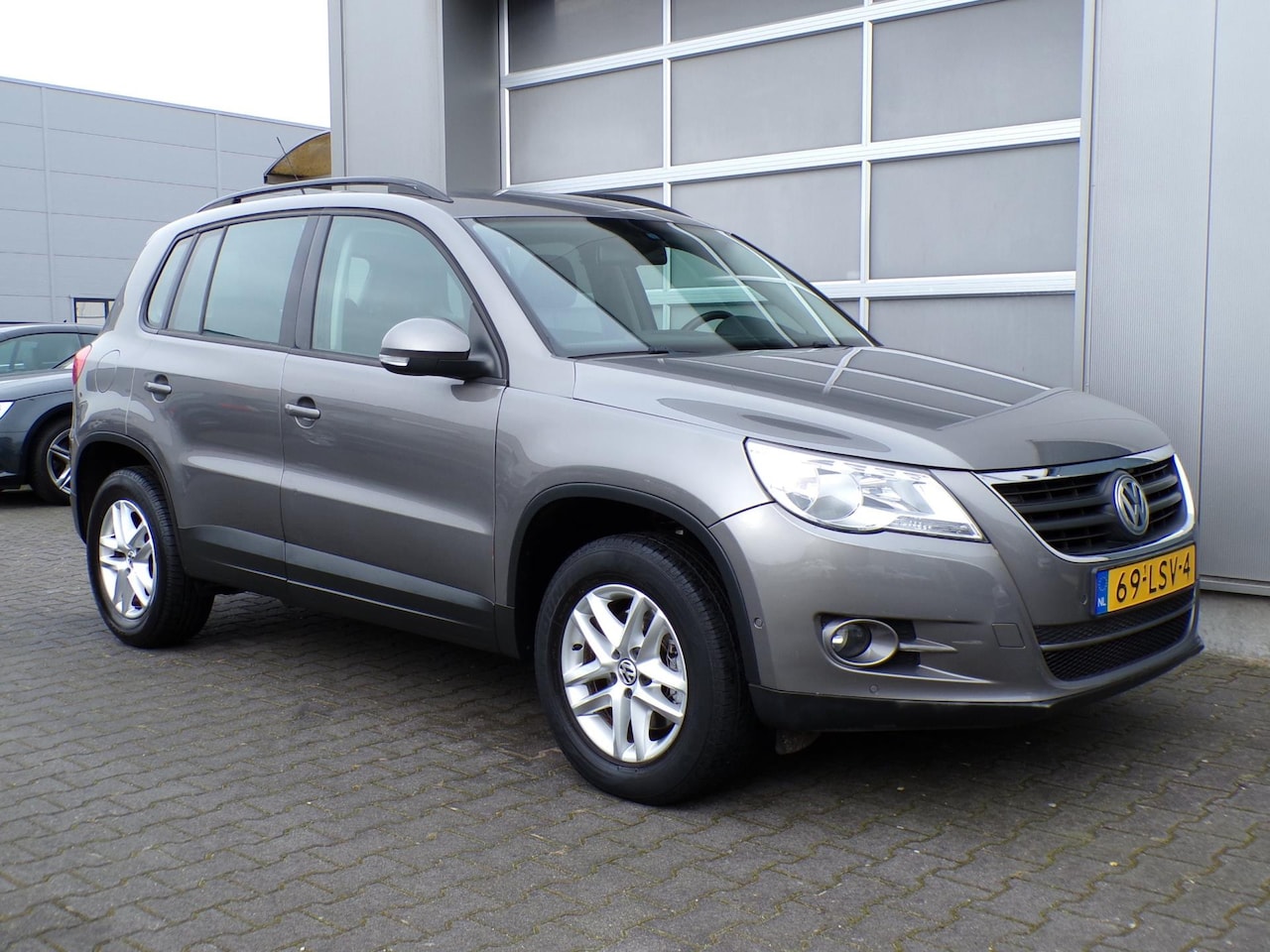 Volkswagen Tiguan - 1.4 TSI Comfort&Design|Scherm|Navi|Cruise|Clima - AutoWereld.nl