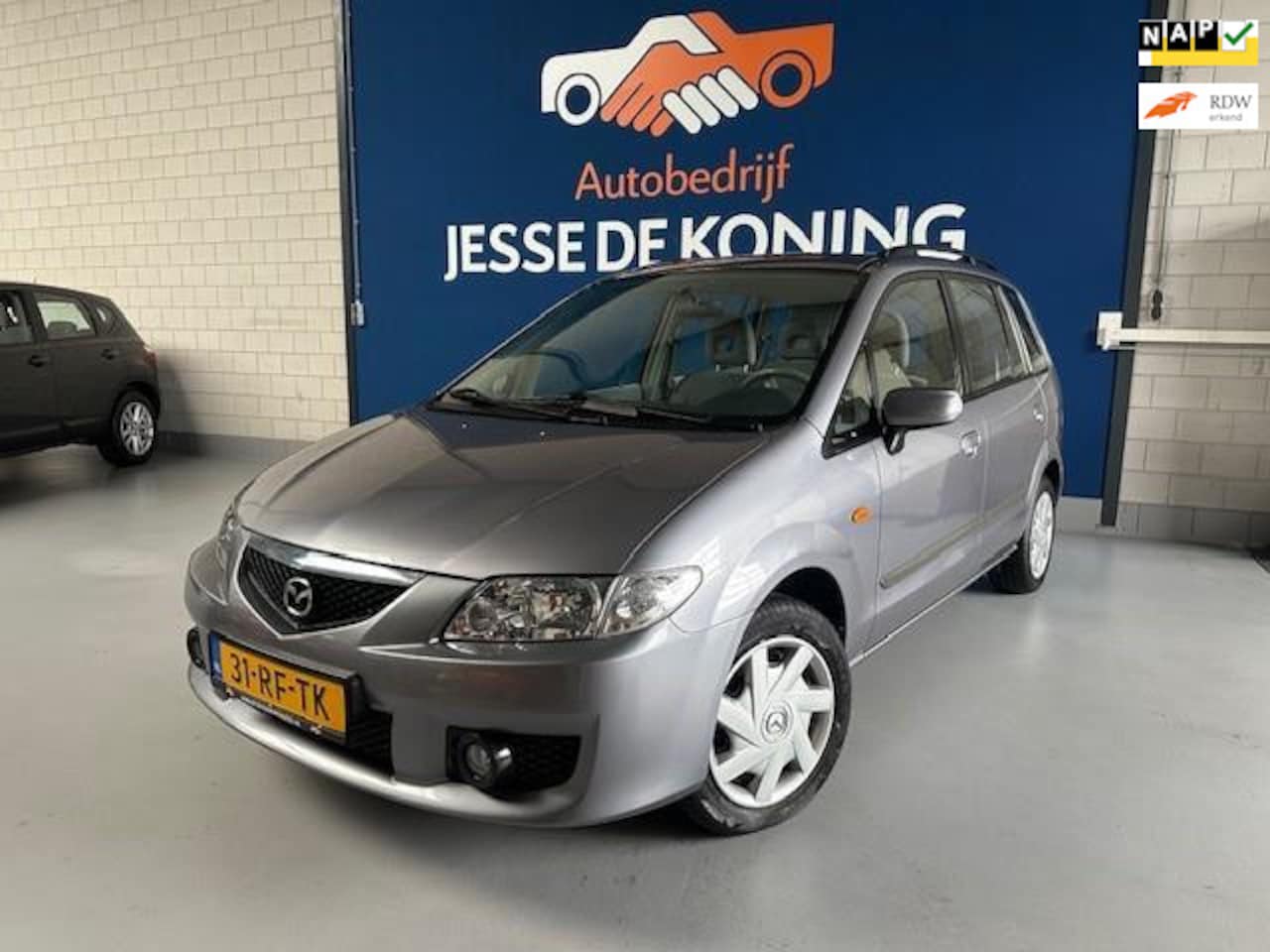 Mazda Premacy - 1.8i Exclusive 1.8i Exclusive,bj.2005,kleur:grijs ! 5 deurs,airco,trekhaak,NAP met 141890 km.en APK tot 0 - AutoWereld.nl