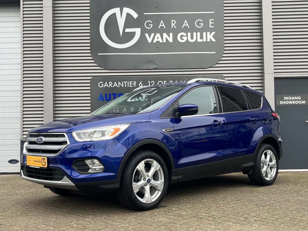 Ford Kuga - 1.5 150PK Navi,Clima,Cruise,Trekhaak,Isofix,Camera,ParkeerSensorenV+A,Stoel+Stuurverw,Blue - AutoWereld.nl