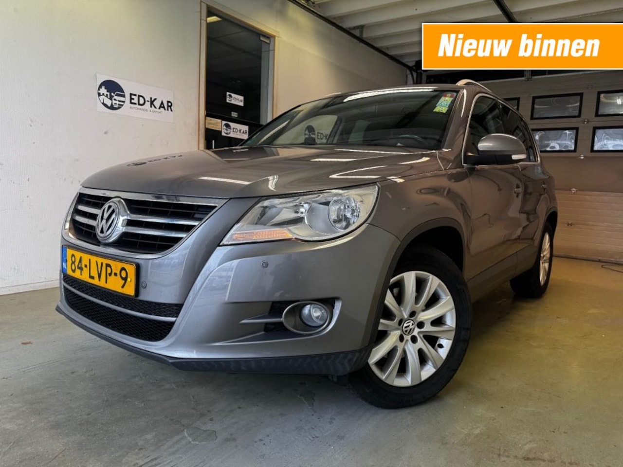 Volkswagen Tiguan - 1.4 TSI SportenStyle CLIMA PANORAMA PDC TREKHHAK NAP APK 2-2026 - AutoWereld.nl