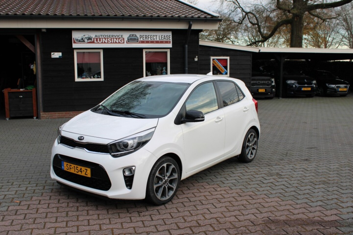 Kia Picanto - 1.0 CVVT DESIGN EDITION - Camera Airco Navi leer - AutoWereld.nl