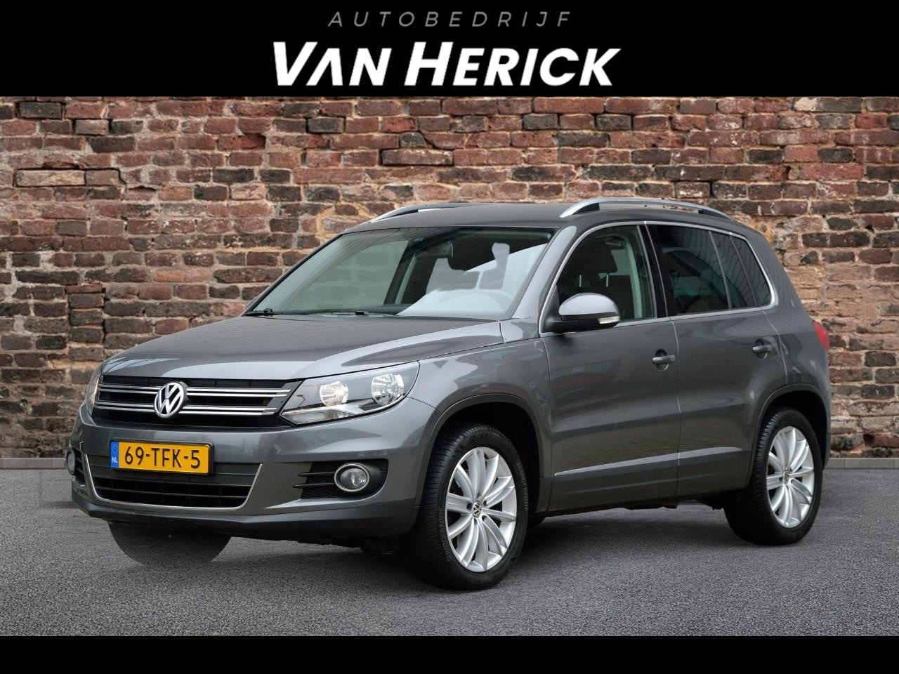 Volkswagen Tiguan - 1.4 TSI Sport&Style 122PK | Trekhaak | Clima | Nette staat - AutoWereld.nl