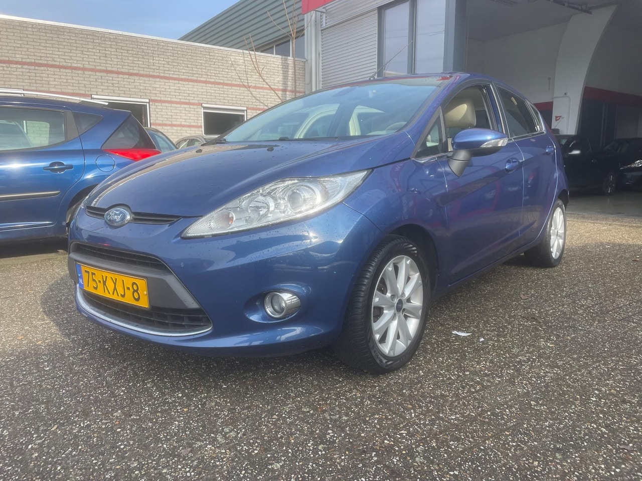 Ford Fiesta - 1.25 Ghia clima pdc nette auto - AutoWereld.nl