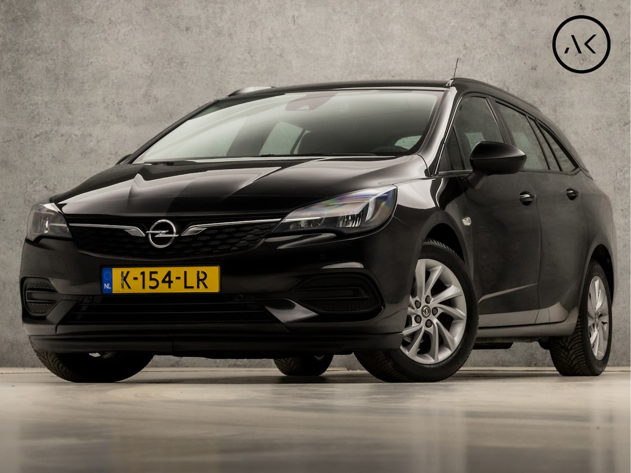 Opel Astra Sports Tourer - 1.4 Business Sport 146Pk Automaat (APPLE CARPLAY, NAVIGATIE, STUUR/STOELVERWARMING, CAMERA - AutoWereld.nl